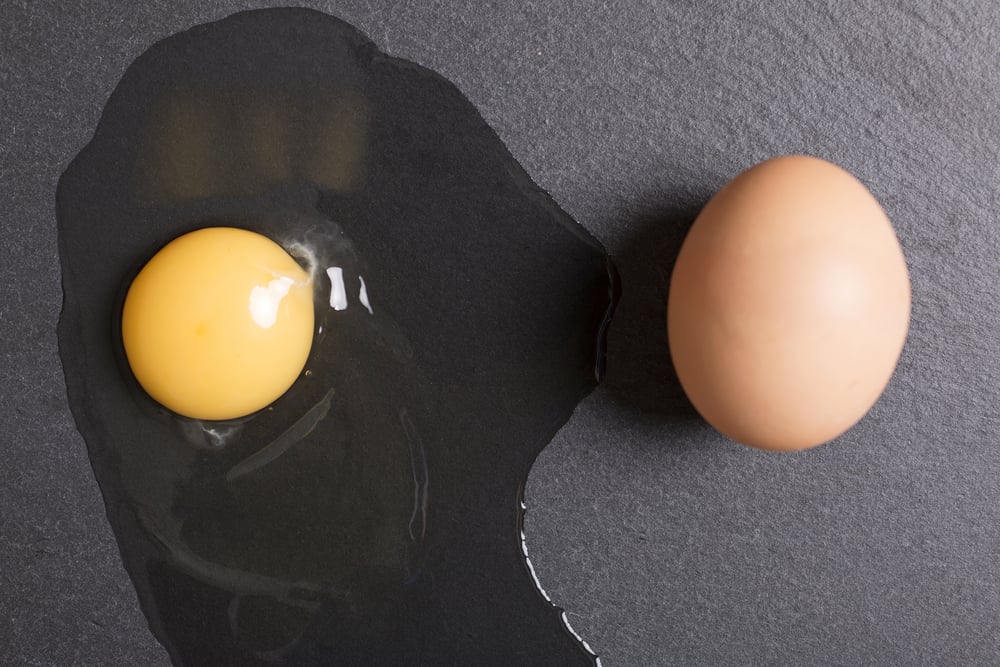 Raw egg poured onto black slate