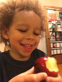 customer_aubrey_child_fruit_smile